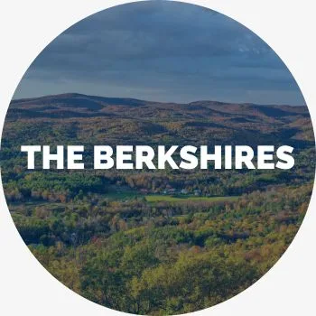 A view of the Berkshire mountains with the words The Berkshires in bold letters
